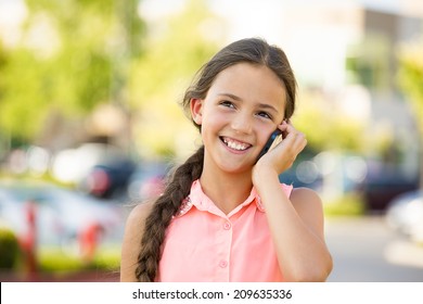 Closeup Portrait, Young Happy Child, Girl Talking On Cell, Smart Phone, Isolated Outdoors Background. Positive Human Emotions, Facial Expressions, Life Perception, Communication