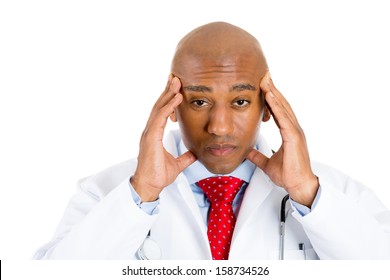 Closeup Portrait Of A Young Male Doctor, Having Bad News, Headache, Stressed Out, Going Through A Lot Of Stress Isolated On White Background. Health Care Reform, Medicaid Plan Reimbursement. Obamacare