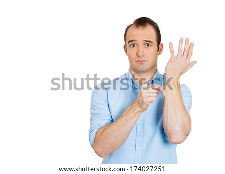 Closeup portrait of young man in blue shirt pinching his skin, giving a reality check gesture, is this a dream, isolated on white background. Positive emotion facial expression feelings, body language