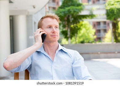 Closeup Portrait, Young Man Listening To Conversation On Cell Phone, Isolated Outdoors Outside Background