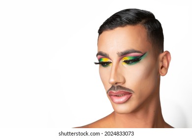 Closeup Portrait Of Young Man With Mustache And Glamorous Makeup On White Background