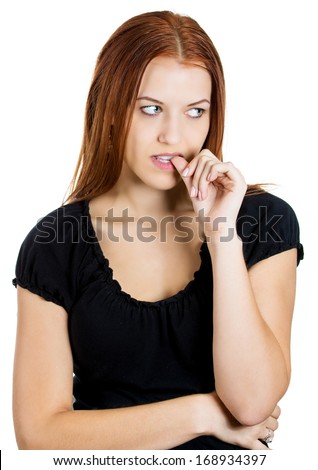 Closeup portrait of a  young nervous woman biting her fingernails craving for something or anxious, isolated on white background. Negative human emotions facial expressions feelings