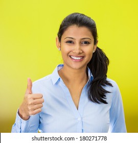 Closeup portrait of young pretty smiling woman, student,customer giving thumbs up sign, isolated on green background. Positive human emotions, facial expression feelings, signs, symbols, body language