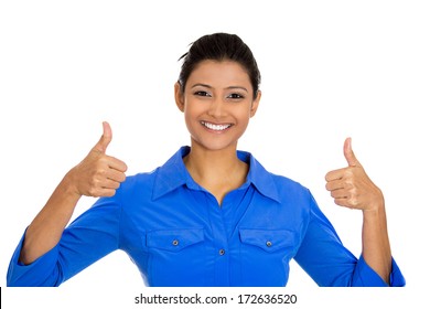 Closeup portrait of young pretty woman with two thumbs up sign gesture pointing at you, isolated on white background. Positive emotion facial expression feelings, signs and symbols, body language