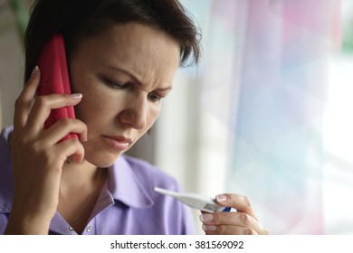 Close-up Portrait Of An Young ,sick Woman Calling To The Doctor