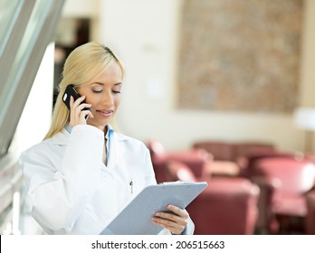 Closeup Portrait, Young Smiling Confident Female Doctor, Healthcare Professional Talking On Phone, Giving Consultation Isolated Background Hospital Office. Patient Visit Health Care. Positive Emotions