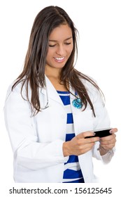 A Closeup Portrait Of A Young Smiling Female Doctor Or Resident Or Nurse Or Health Care Professional Texting On Her Phone Or Pager.On Call, On Duty, In Hospital Communication.