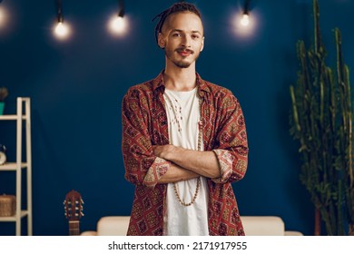 Close-up portrait of a young stylish man with dreadlocks - Powered by Shutterstock