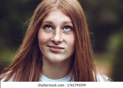 Close-up Portrait Of Young Teen Freckled Ginger Girl Making Goofy Face