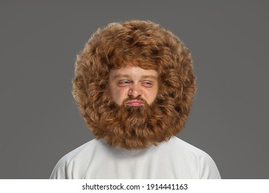 Close-up portrait of young very hairy man isolated over grey background. - Shutterstock ID 1914441163