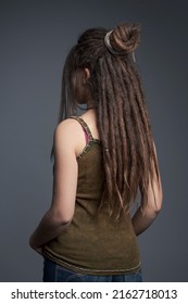 Closeup Portrait Of Young Woman,  Dreadlocks And Long Hair￼ Back View