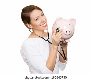 Closeup Portrait Young Woman Listening To Piggy Bank With Stethoscope. Medical Insurance, Medicare Reimbursement. Curious Nurse, Doctor, Patient Or Business Lady. Health Law Coverage, Company Report