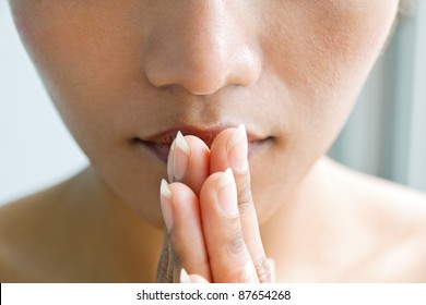 Closeup Portrait Of A Young Woman Praying. Detail Face With Hands In A Praying Position. Meditation Woman Close Up. Spiritual Moment. Praying With Hands In His Face. Asian Girl Praying.Faith And Hope.