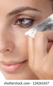 Closeup Portrait Of Young Woman Removing Eye Makeup, By Cotton Pad.