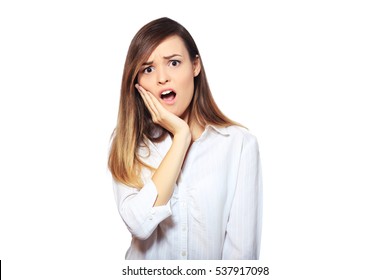 Closeup Portrait Young Woman With Sensitive Tooth Ache, Crown Problem About To Cry From Pain, Touching Outside Mouth With Hand, Isolated White Background. Negative Emotions, Facial Expression, Feeling