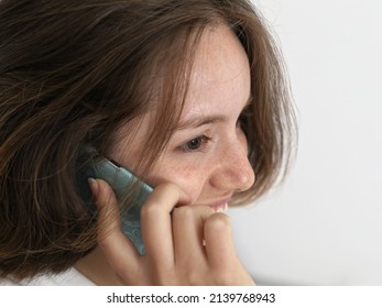 Close-up Portrait Of Young Woman Smiling While Talking On Cell P