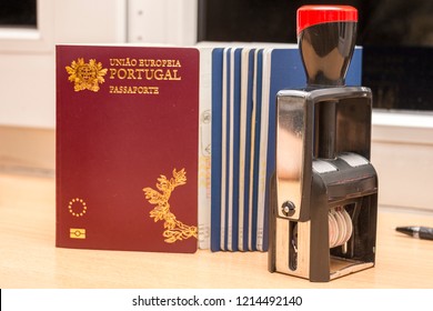 Close-up of a portuguese biometric passport and the datastamp during passport control at the border. Border crossing, travel, immigration concept