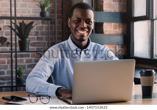 Closeup Positive Afrcan Man Sitting Front Royalty Free Stock Image