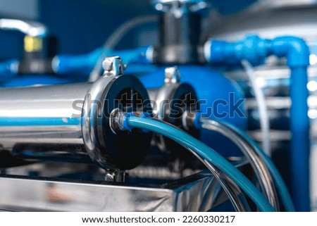 Closeup of the post carbon filter of a reverse osmosis water station.