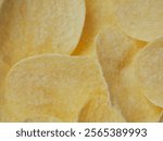 Close-up of potato chips, flat slices
  