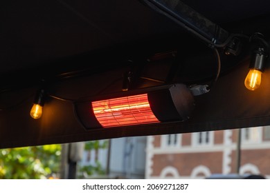 Close-up Of A Powered Patio Heater Outdoors Of A Restaurant, Concept For Negative Carbon Footprint