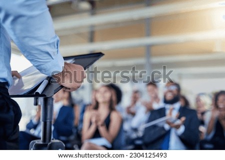 Closeup, presentation and speaker with crowd, applause or speech with workshop, seminar or discussion. Zoom, male person or leader with audience, announcement or motivation with support or solidarity