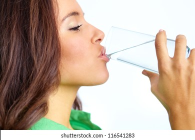 Close-up Of Pretty Girl Drinking Water From Glass