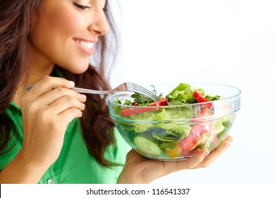 Close-up Of Pretty Girl Eating Fresh Vegetable Salad