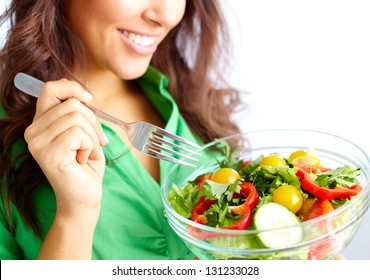 Close-up Of Pretty Girl Eating Fresh Vegetable Salad