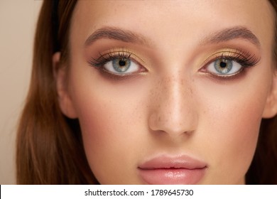 Close-up Of A Pretty Girl's Face With Beautiful Big Blue Eyes, Big Lashes And Eyebrows