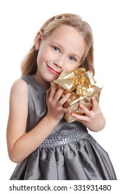 Closeup of a pretty little girl with a present