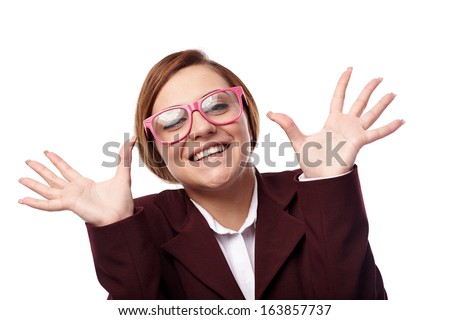 Closeup of pretty young woman wearing nerd glasses and grinning isolated on white background