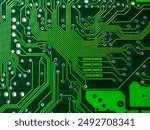 Close-up of a printed circuit board with chips, showing the complex connections and electronics parts.