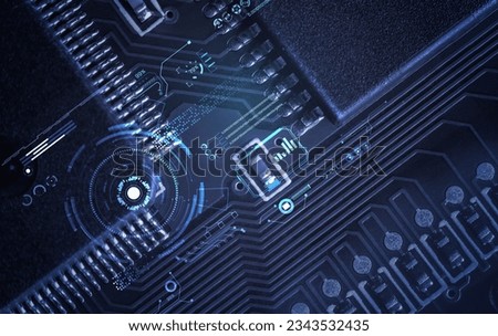 Closeup of Printed Circuit Board with processor, integrated circuits and many other surface mounted passive electrical components.