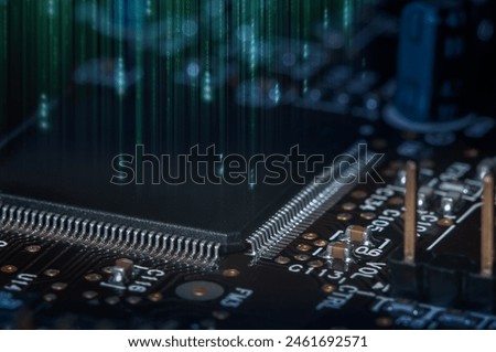 Closeup of Printed Circuit Board with processor, integrated circuits and many other surface mounted passive electrical components.