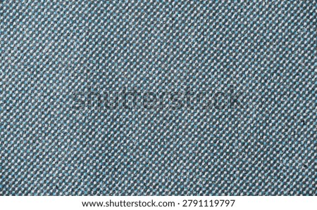 Close-up of printed halftone texture with alternating cyan and black dots on white textured paper, showing dense dot alignment and visible fibers.