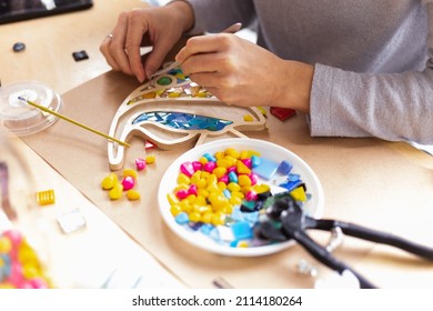 Close-up of the process of making colored glass mosaic pieces. Master class on making mosaic panels - Shutterstock ID 2114180264