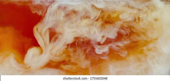 Closeup Process Of Pouring Milk, Cream Into Transparent Glass Cup Of Traditional English Black Tea. Abstract Brown Background With Light Stains. Mixing Of Liquids. Hot Drinks, Beverages Concept.