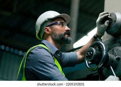 close-up professional heavy industry engineer Workers wearing safety suits, goggles and hard hats in industrial factory background. - Powered by Shutterstock