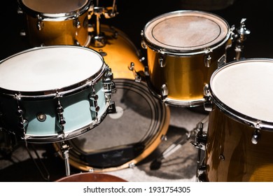 Closeup professional musical instrument. Drum kit for jazz band in recording studio. Drumsticks lying on drum. Drum set with drum cymbals.