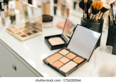 Close-up Of Professional Powder Box On Woman Table Near Mirror, No People, Top View. Concept Of Beauty, Fashion And Stylish Makeup.