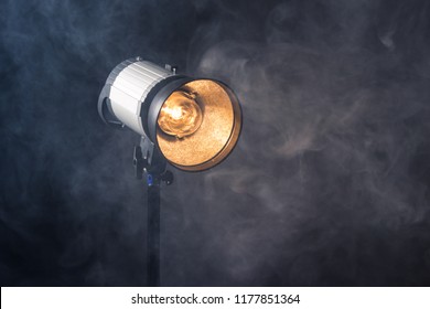 Close-up of professional studio light. Concept photoshoot in the fog