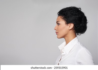 Closeup profile of confident business woman looking forward isolated on gray background - Shutterstock ID 259315901