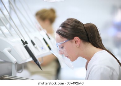 Closeup Profile Of A Dental Student Preparing For Work In Dental School