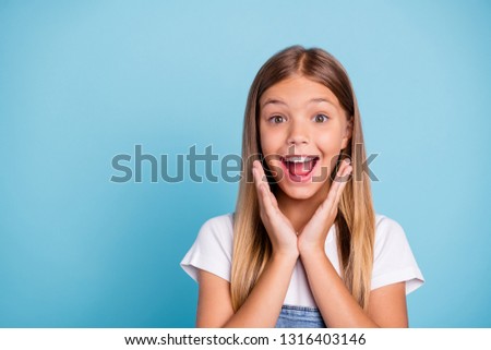 Close-up profile side portrait of her she nice cute lovely attractive cheerful amazed glad funny straight-haired blonde girl opened mouth gift present wish isolated on blue pastel background