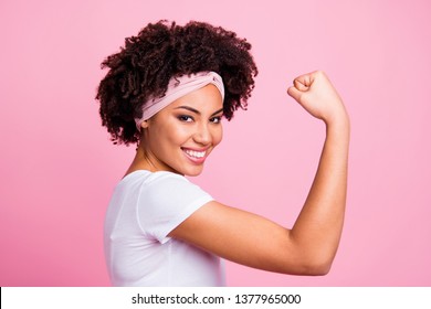 Close-up profile side view portrait of her she nice-looking attractive charming cute lovely powerful cheerful cheery wavy-haired girl showing muscles isolated over pink pastel background
