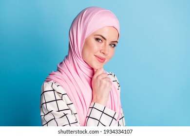 Close-up profile side view portrait of pretty cunning cheery muslimah girl touching chin thinking isolated over bright blue color background - Powered by Shutterstock