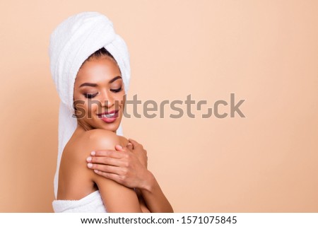 Close-up profile side view portrait of her she nice-looking attractive well-groomed cheerful dreamy lady caressing touching flawless smooth skin isolated over beige pastel background