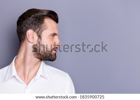 Close-up profile side view portrait of his he nice attractive virile brunet guy groomed, unshaven beard copy empty blank place space isolated over gray pastel color background