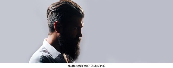 Closeup profile silhouette of bearded man with classic black long beard, bearded gay. Barber barbershop. Mustache men, serious face close up. Templates web banner design. Banner for website.